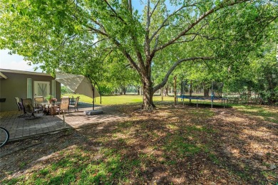 This beautifully maintained home features 4-bedrooms, 2.5-baths on Rio Pinar Golf and Country Club in Florida - for sale on GolfHomes.com, golf home, golf lot