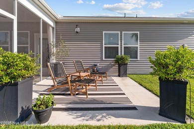 Contemporary coastal elegance defines this nearly new Eagle Run on Crow Creek Golf Club in North Carolina - for sale on GolfHomes.com, golf home, golf lot