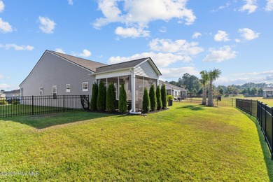 Contemporary coastal elegance defines this nearly new Eagle Run on Crow Creek Golf Club in North Carolina - for sale on GolfHomes.com, golf home, golf lot