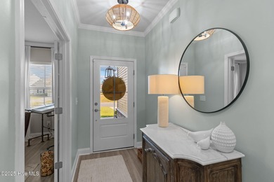 Contemporary coastal elegance defines this nearly new Eagle Run on Crow Creek Golf Club in North Carolina - for sale on GolfHomes.com, golf home, golf lot