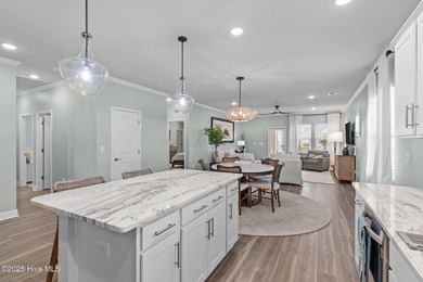 Contemporary coastal elegance defines this nearly new Eagle Run on Crow Creek Golf Club in North Carolina - for sale on GolfHomes.com, golf home, golf lot