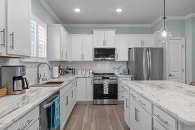 Contemporary coastal elegance defines this nearly new Eagle Run on Crow Creek Golf Club in North Carolina - for sale on GolfHomes.com, golf home, golf lot