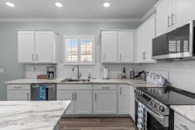 Contemporary coastal elegance defines this nearly new Eagle Run on Crow Creek Golf Club in North Carolina - for sale on GolfHomes.com, golf home, golf lot
