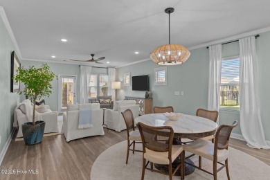 Contemporary coastal elegance defines this nearly new Eagle Run on Crow Creek Golf Club in North Carolina - for sale on GolfHomes.com, golf home, golf lot