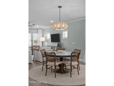 Contemporary coastal elegance defines this nearly new Eagle Run on Crow Creek Golf Club in North Carolina - for sale on GolfHomes.com, golf home, golf lot