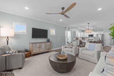 Contemporary coastal elegance defines this nearly new Eagle Run on Crow Creek Golf Club in North Carolina - for sale on GolfHomes.com, golf home, golf lot