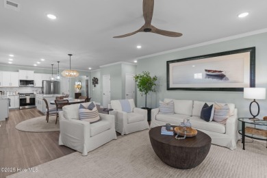 Contemporary coastal elegance defines this nearly new Eagle Run on Crow Creek Golf Club in North Carolina - for sale on GolfHomes.com, golf home, golf lot