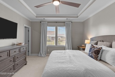 Contemporary coastal elegance defines this nearly new Eagle Run on Crow Creek Golf Club in North Carolina - for sale on GolfHomes.com, golf home, golf lot
