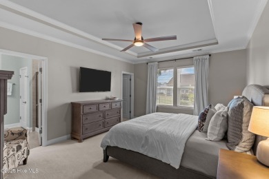 Contemporary coastal elegance defines this nearly new Eagle Run on Crow Creek Golf Club in North Carolina - for sale on GolfHomes.com, golf home, golf lot