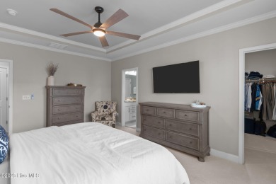 Contemporary coastal elegance defines this nearly new Eagle Run on Crow Creek Golf Club in North Carolina - for sale on GolfHomes.com, golf home, golf lot