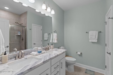 Contemporary coastal elegance defines this nearly new Eagle Run on Crow Creek Golf Club in North Carolina - for sale on GolfHomes.com, golf home, golf lot