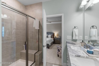 Contemporary coastal elegance defines this nearly new Eagle Run on Crow Creek Golf Club in North Carolina - for sale on GolfHomes.com, golf home, golf lot