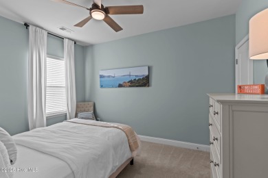 Contemporary coastal elegance defines this nearly new Eagle Run on Crow Creek Golf Club in North Carolina - for sale on GolfHomes.com, golf home, golf lot