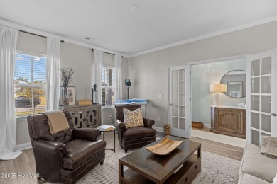 Contemporary coastal elegance defines this nearly new Eagle Run on Crow Creek Golf Club in North Carolina - for sale on GolfHomes.com, golf home, golf lot