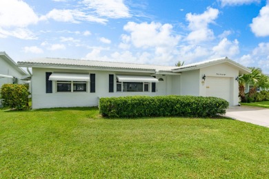 Your Florida oasis awaits here at Palm Beach Leisureville! This on Leisureville Community Golf Course in Florida - for sale on GolfHomes.com, golf home, golf lot