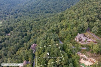 This homesite offers a rare blend of mountain scenery and on The Country Club of Sapphire Valley in North Carolina - for sale on GolfHomes.com, golf home, golf lot