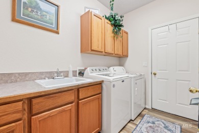 This lovely single level home in a gated community offers easy on Ridgecrest Golf Course in Idaho - for sale on GolfHomes.com, golf home, golf lot