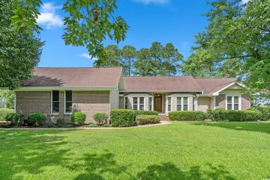 Nestled on a stunning HALF-ACRE corner lot directly on the on Myrtle Beach National Golf Course in South Carolina - for sale on GolfHomes.com, golf home, golf lot