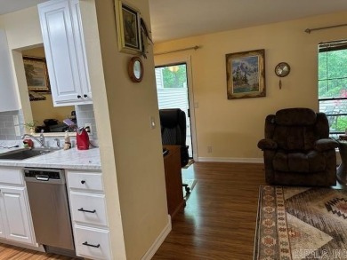 Discover the allure of modern living in this beautifully on Indian Hills Country Club in Arkansas - for sale on GolfHomes.com, golf home, golf lot