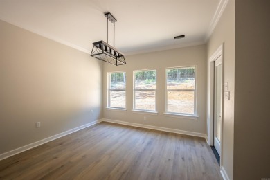 This stunning 5-bedroom, 3-bath brick home offers modern design on The Course At Eagle Mountain in Arkansas - for sale on GolfHomes.com, golf home, golf lot