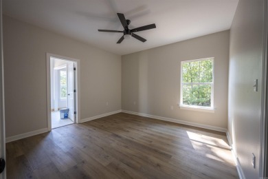 This stunning 5-bedroom, 3-bath brick home offers modern design on The Course At Eagle Mountain in Arkansas - for sale on GolfHomes.com, golf home, golf lot