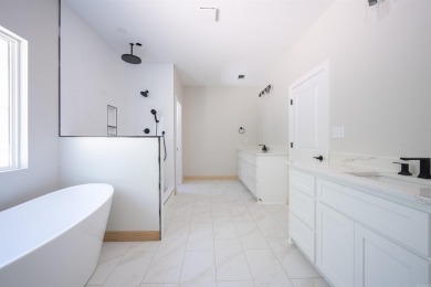 This stunning 5-bedroom, 3-bath brick home offers modern design on The Course At Eagle Mountain in Arkansas - for sale on GolfHomes.com, golf home, golf lot