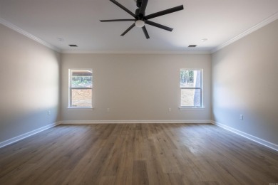 This stunning 5-bedroom, 3-bath brick home offers modern design on The Course At Eagle Mountain in Arkansas - for sale on GolfHomes.com, golf home, golf lot