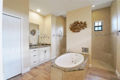 Stunning 3-bedroom, 3-bath Pool Home with 3-car garage in highly on Deep Creek Golf Club in Florida - for sale on GolfHomes.com, golf home, golf lot