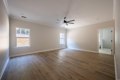 This stunning 5-bedroom, 3-bath brick home offers modern design on The Course At Eagle Mountain in Arkansas - for sale on GolfHomes.com, golf home, golf lot