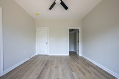 This stunning 5-bedroom, 3-bath brick home offers modern design on The Course At Eagle Mountain in Arkansas - for sale on GolfHomes.com, golf home, golf lot