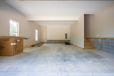 This stunning 5-bedroom, 3-bath brick home offers modern design on The Course At Eagle Mountain in Arkansas - for sale on GolfHomes.com, golf home, golf lot