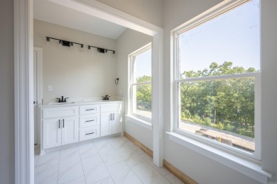 This stunning 5-bedroom, 3-bath brick home offers modern design on The Course At Eagle Mountain in Arkansas - for sale on GolfHomes.com, golf home, golf lot