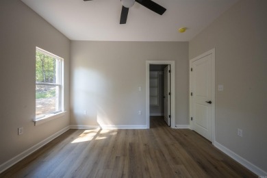 This stunning 5-bedroom, 3-bath brick home offers modern design on The Course At Eagle Mountain in Arkansas - for sale on GolfHomes.com, golf home, golf lot