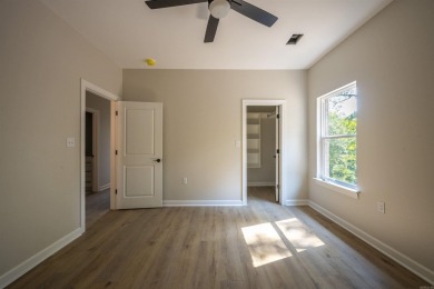 This stunning 5-bedroom, 3-bath brick home offers modern design on The Course At Eagle Mountain in Arkansas - for sale on GolfHomes.com, golf home, golf lot