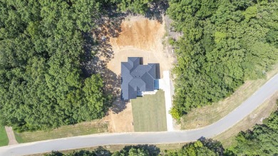 This stunning 5-bedroom, 3-bath brick home offers modern design on The Course At Eagle Mountain in Arkansas - for sale on GolfHomes.com, golf home, golf lot
