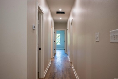 This stunning 5-bedroom, 3-bath brick home offers modern design on The Course At Eagle Mountain in Arkansas - for sale on GolfHomes.com, golf home, golf lot