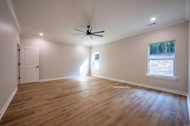 This stunning 5-bedroom, 3-bath brick home offers modern design on The Course At Eagle Mountain in Arkansas - for sale on GolfHomes.com, golf home, golf lot