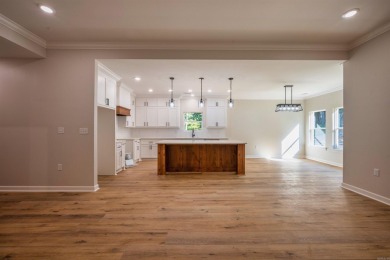 This stunning 5-bedroom, 3-bath brick home offers modern design on The Course At Eagle Mountain in Arkansas - for sale on GolfHomes.com, golf home, golf lot