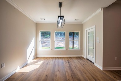 This stunning 5-bedroom, 3-bath brick home offers modern design on The Course At Eagle Mountain in Arkansas - for sale on GolfHomes.com, golf home, golf lot