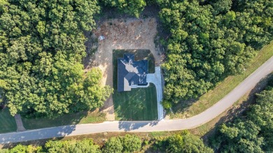 This stunning 5-bedroom, 3-bath brick home offers modern design on The Course At Eagle Mountain in Arkansas - for sale on GolfHomes.com, golf home, golf lot