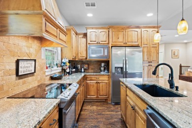 Situated on an oversized corner lot in the gated community of on The Coves Golf Course in Oklahoma - for sale on GolfHomes.com, golf home, golf lot