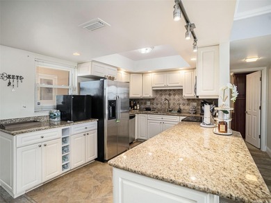 Welcome to your dream home at Point Brittany, one of the most on Isla Del Sol Yacht and Country Club in Florida - for sale on GolfHomes.com, golf home, golf lot