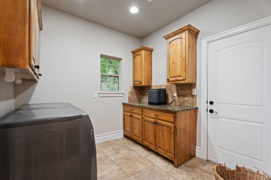Situated on an oversized corner lot in the gated community of on The Coves Golf Course in Oklahoma - for sale on GolfHomes.com, golf home, golf lot