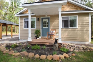 Not your average cottage! This 2023 built Timberland Cottage has on Voyager Village Country Club - Voyager in Wisconsin - for sale on GolfHomes.com, golf home, golf lot