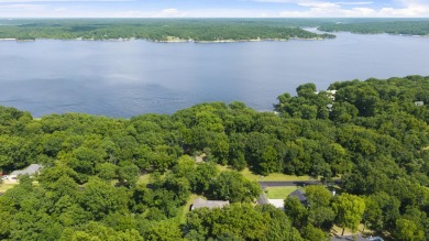 Situated on an oversized corner lot in the gated community of on The Coves Golf Course in Oklahoma - for sale on GolfHomes.com, golf home, golf lot