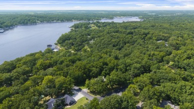 Situated on an oversized corner lot in the gated community of on The Coves Golf Course in Oklahoma - for sale on GolfHomes.com, golf home, golf lot
