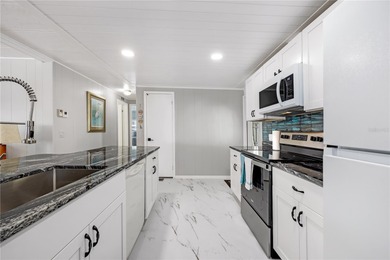 Step right up to your next chapter of fabulous living in this on Maple Leaf Golf and Country Club in Florida - for sale on GolfHomes.com, golf home, golf lot