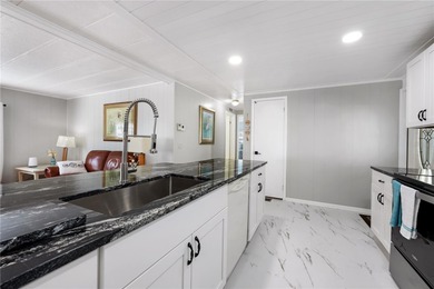 Step right up to your next chapter of fabulous living in this on Maple Leaf Golf and Country Club in Florida - for sale on GolfHomes.com, golf home, golf lot