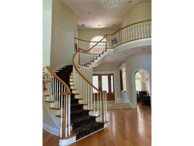 Residential home on golf course in a gated on Wentworth Golf Club in Florida - for sale on GolfHomes.com, golf home, golf lot