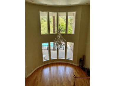 Residential home on golf course in a gated on Wentworth Golf Club in Florida - for sale on GolfHomes.com, golf home, golf lot